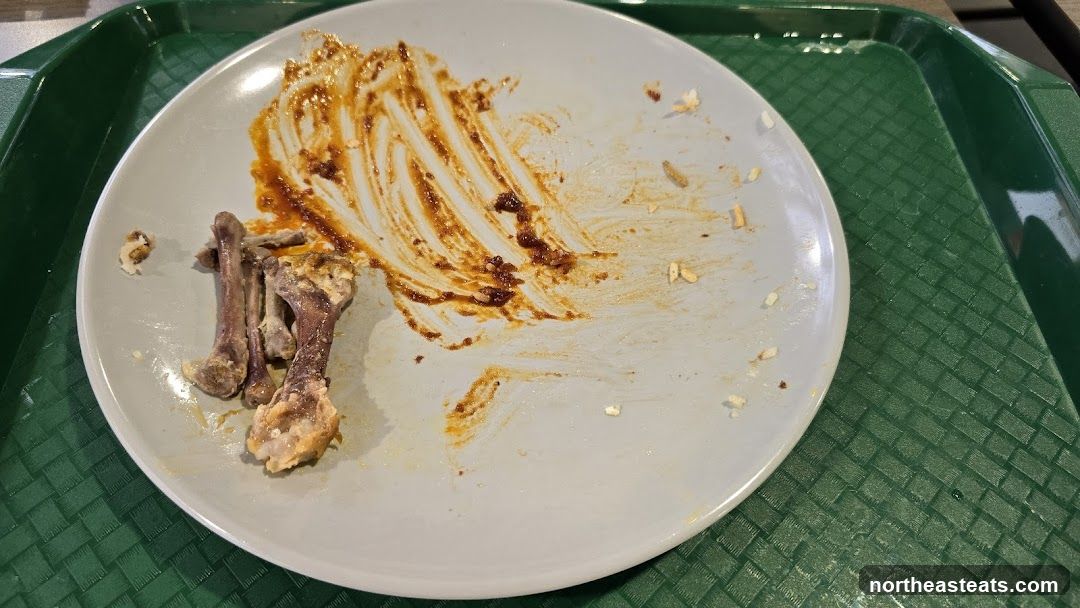 Dirty Plate with Bones and Sauce Smears