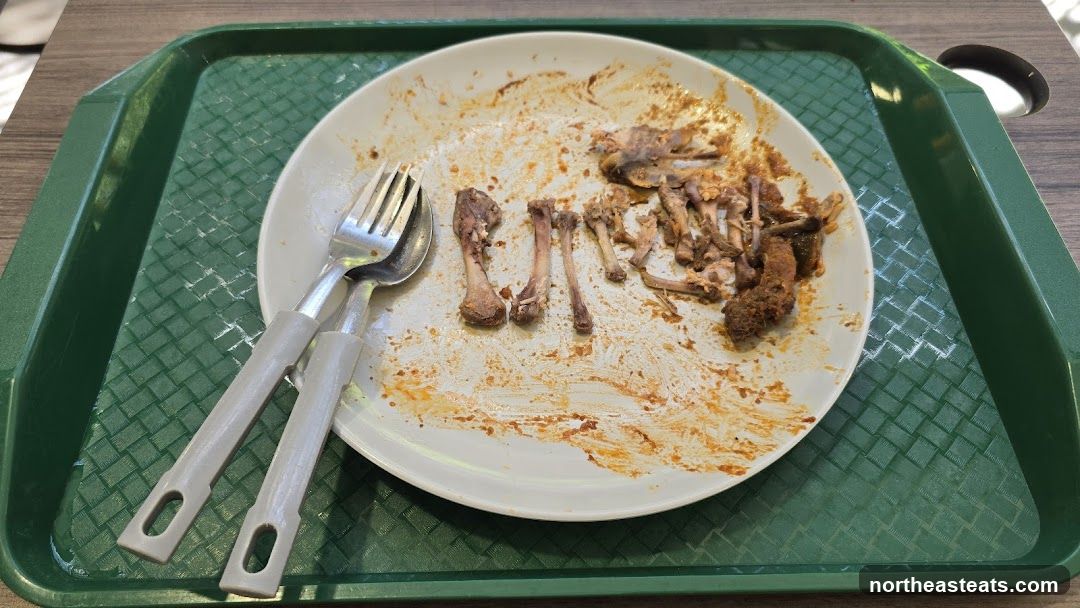 Dirty Plate with Bones and Utensils