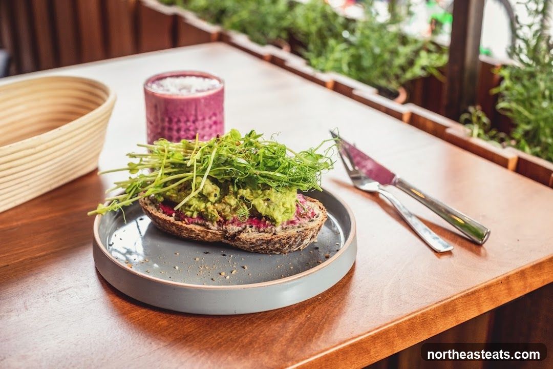 Avocado toast with sprouts and a smoothie