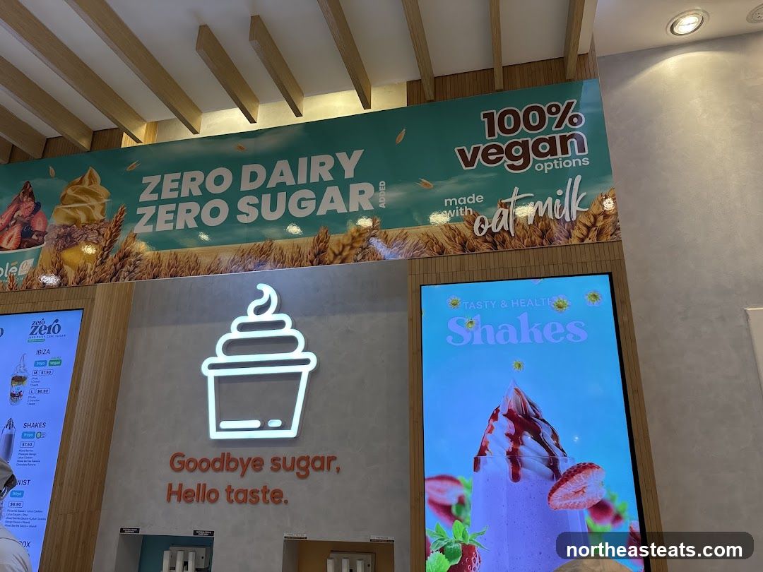 Dessert shop interior with digital menus and signage