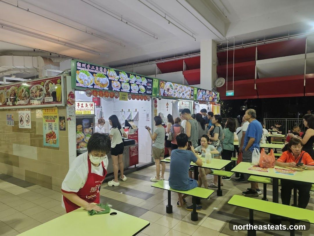 Food court with diners and food stalls