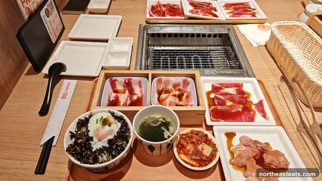Table Setting with Grilled Meats and Rice Bowl