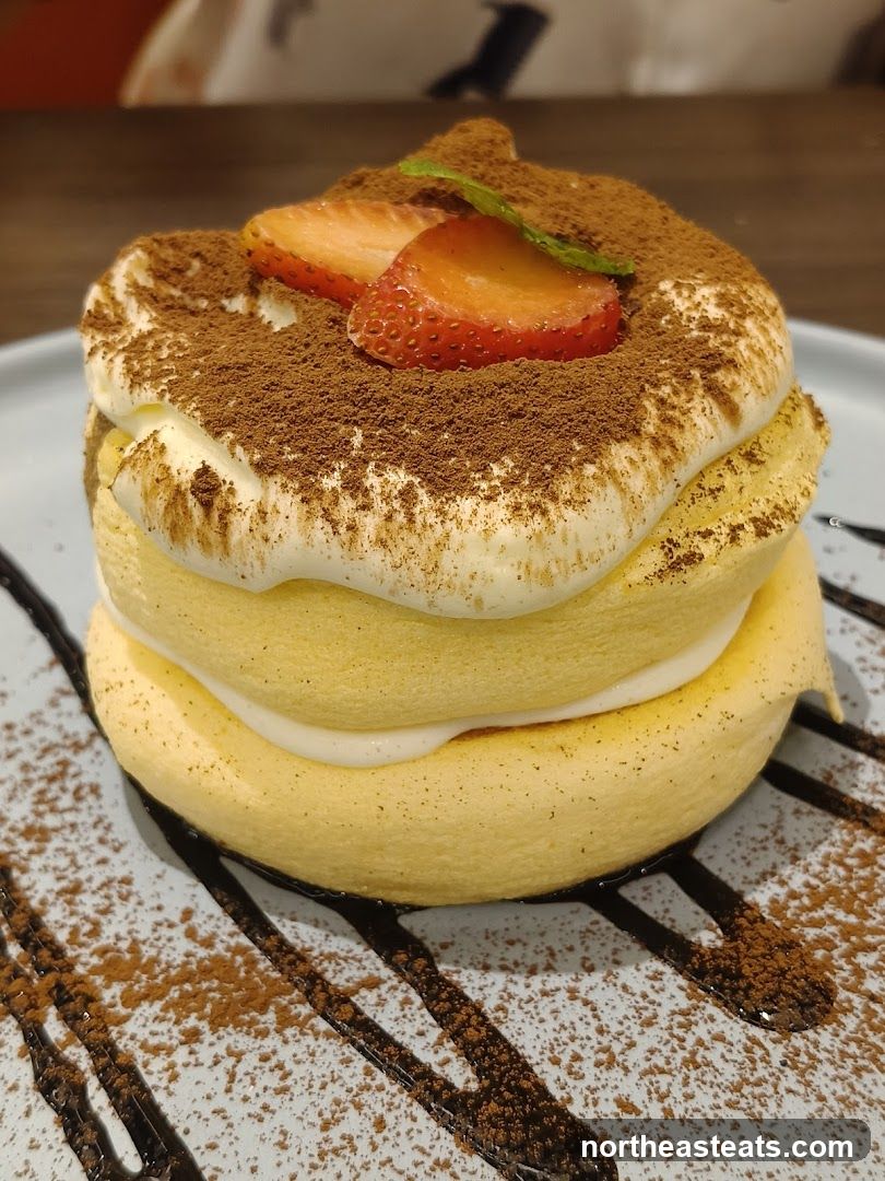 Fluffy Pancakes with Strawberries and Cocoa Powder
