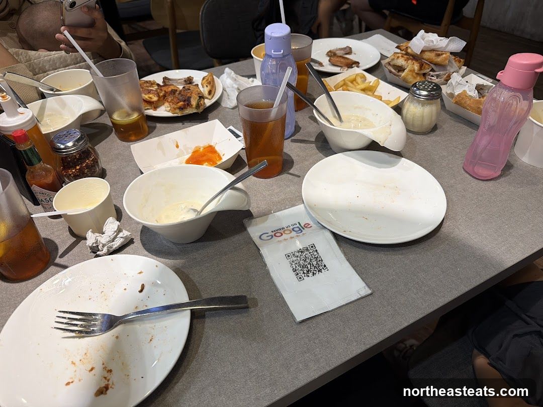 Table with leftover food and drinks