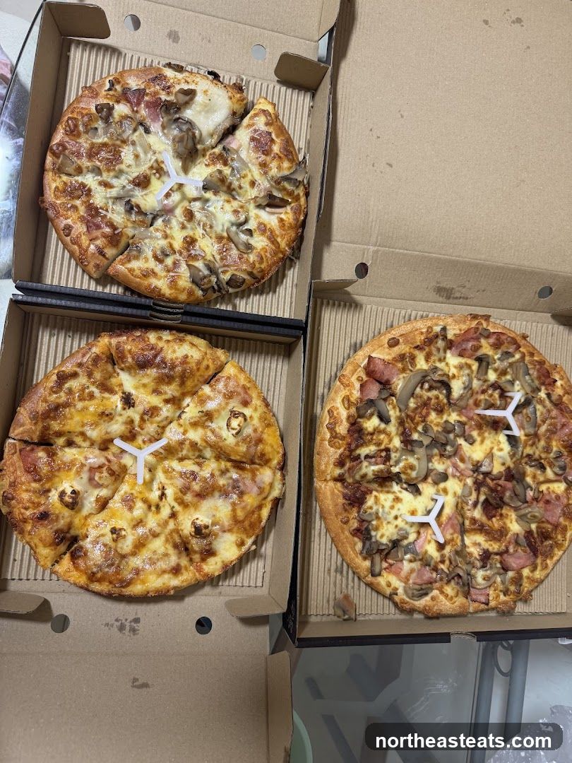 Three Pizzas in Boxes