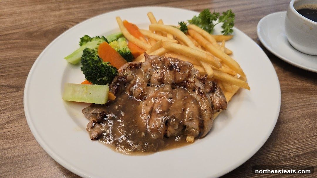 Chicken steak with fries and vegetables
