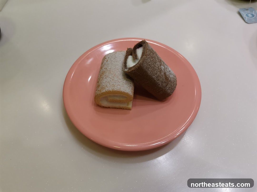 Two Swiss Rolls on a Plate