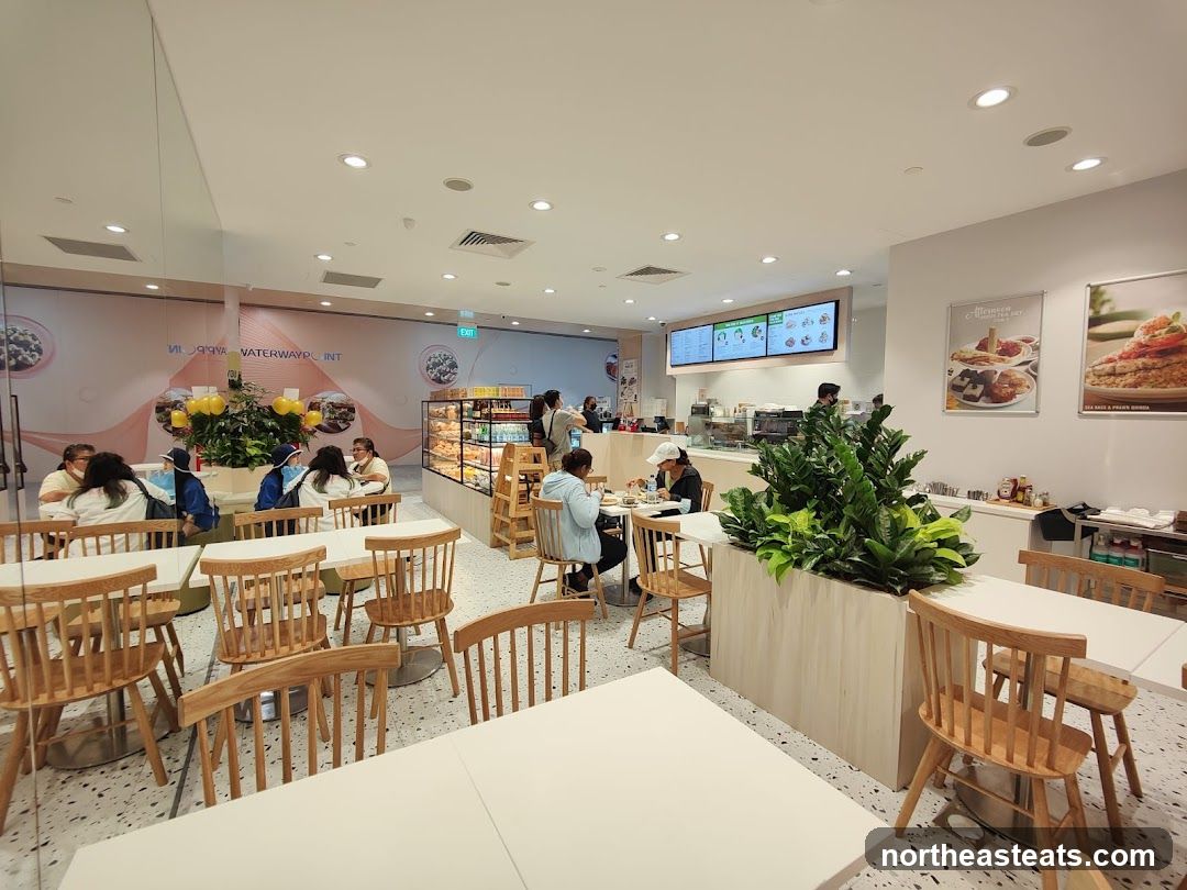 Cafe Interior with Diners and Display Case