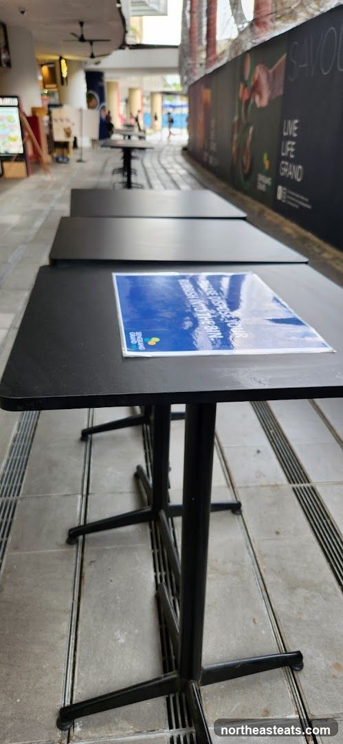 Outdoor seating area with safety signage