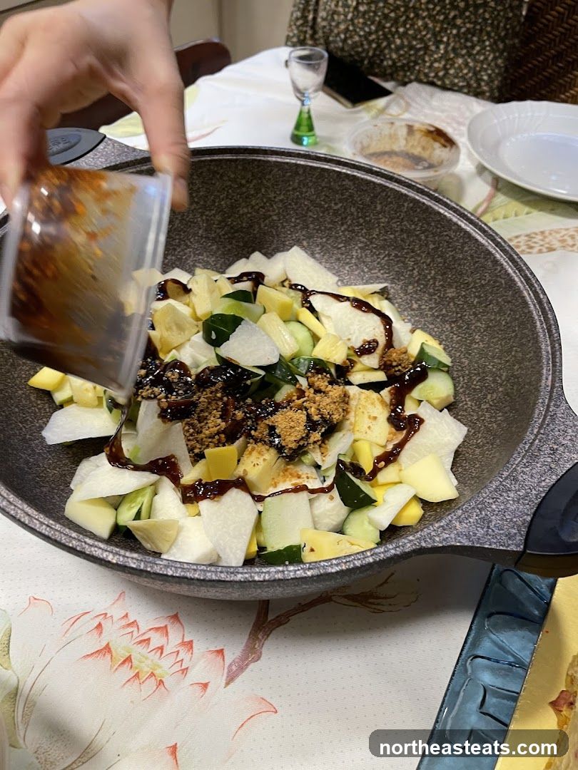 Adding dressing to fruit salad