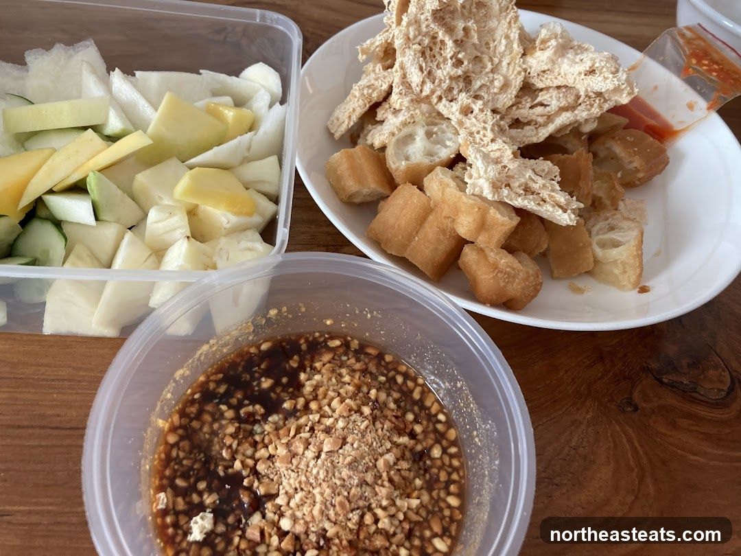 Fruit Salad with Fried Dough and Peanut Sauce