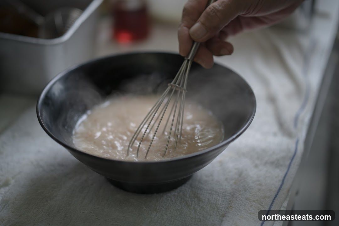 Whisking a mixture in a bowl