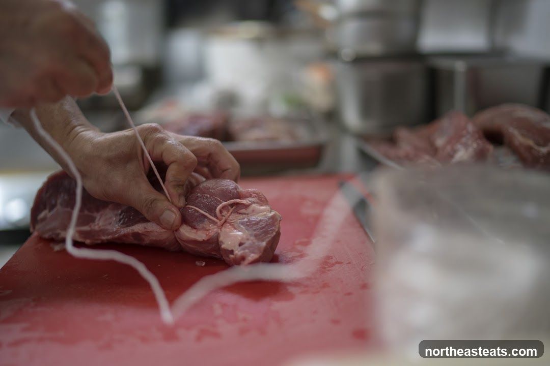 Butcher Tying Meat