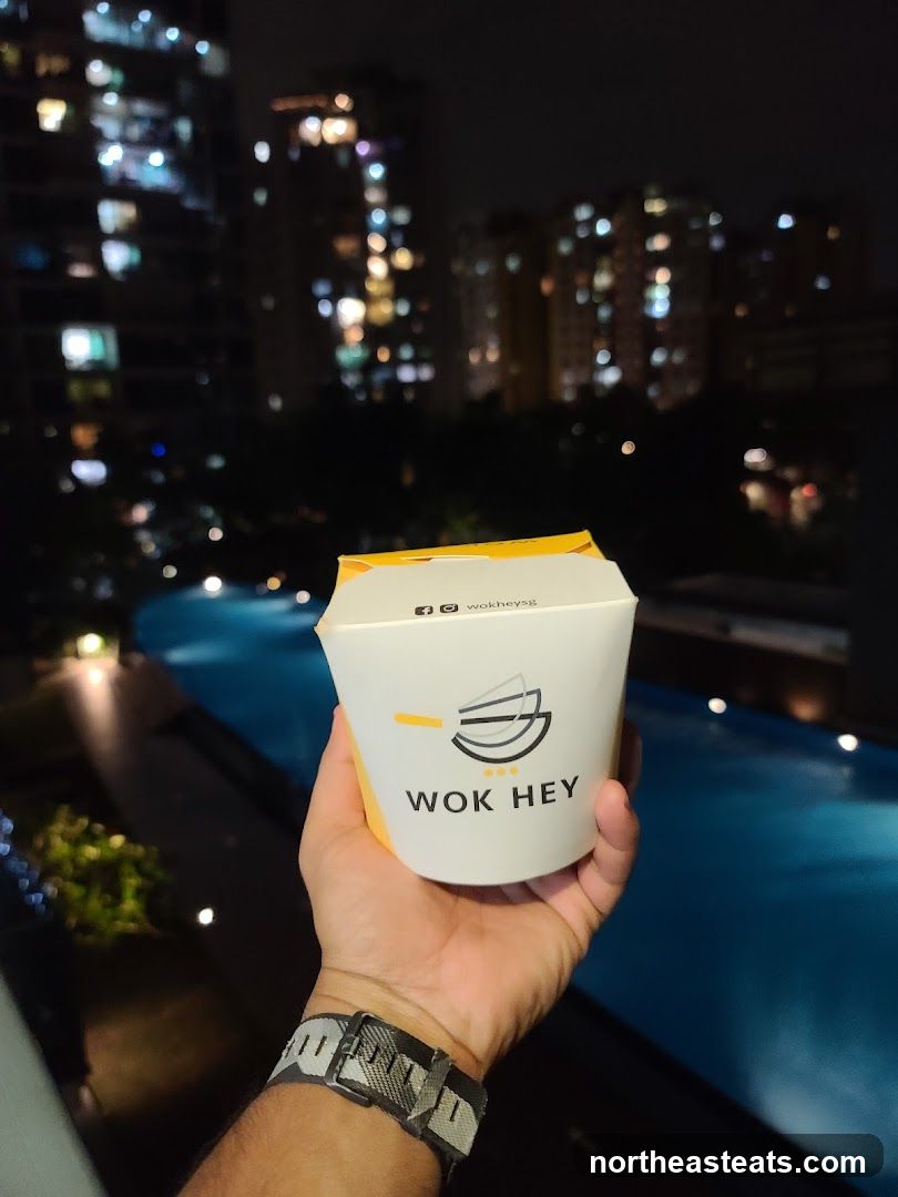 Takeaway container with Wok Hey logo
