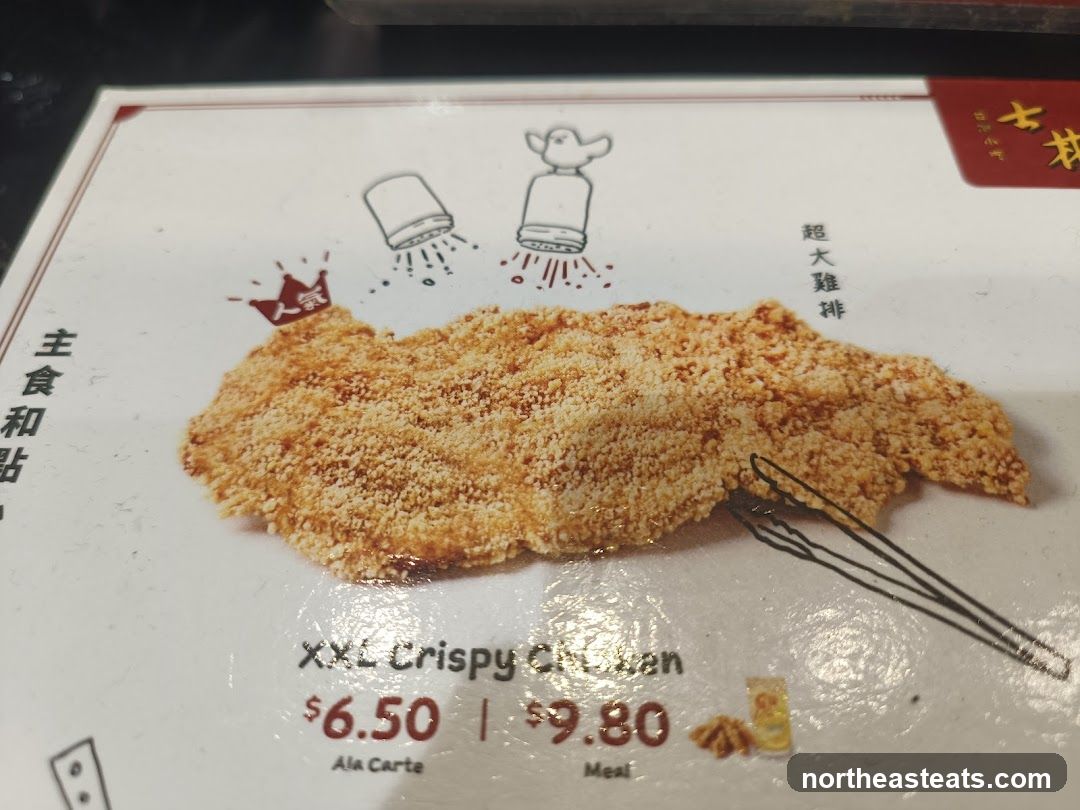 A menu item featuring a large, breaded chicken cutlet.
