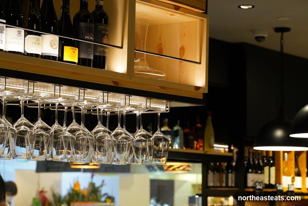 Wine glasses and bottles in a bar