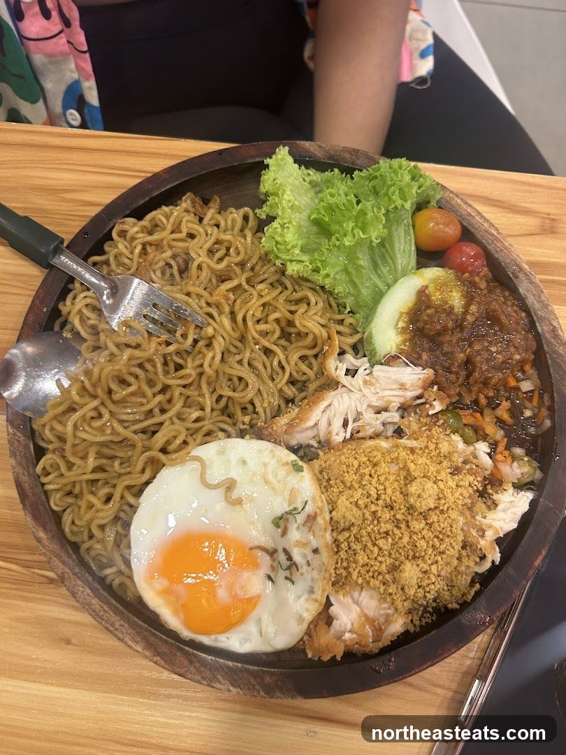 Noodle Dish with Fried Egg and Chicken