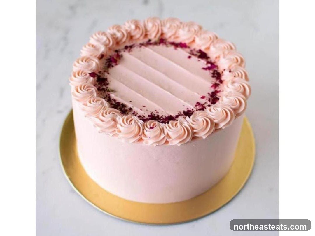 Pink Frosted Cake with Rose Swirls