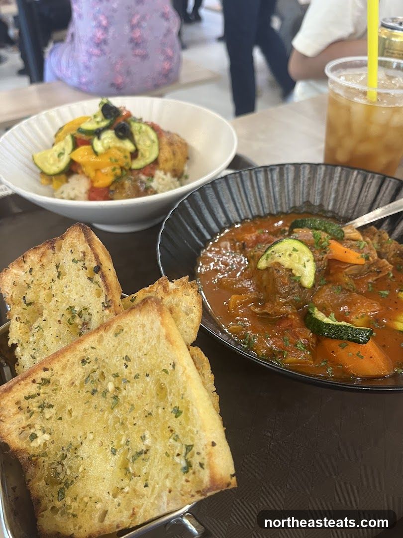 Food spread with garlic bread and stew