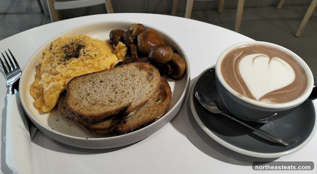Scrambled Eggs with Toast and Mushrooms and a Latte