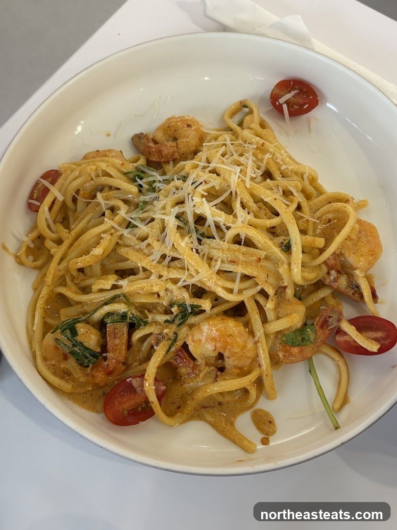 Shrimp pasta with cherry tomatoes and grated cheese