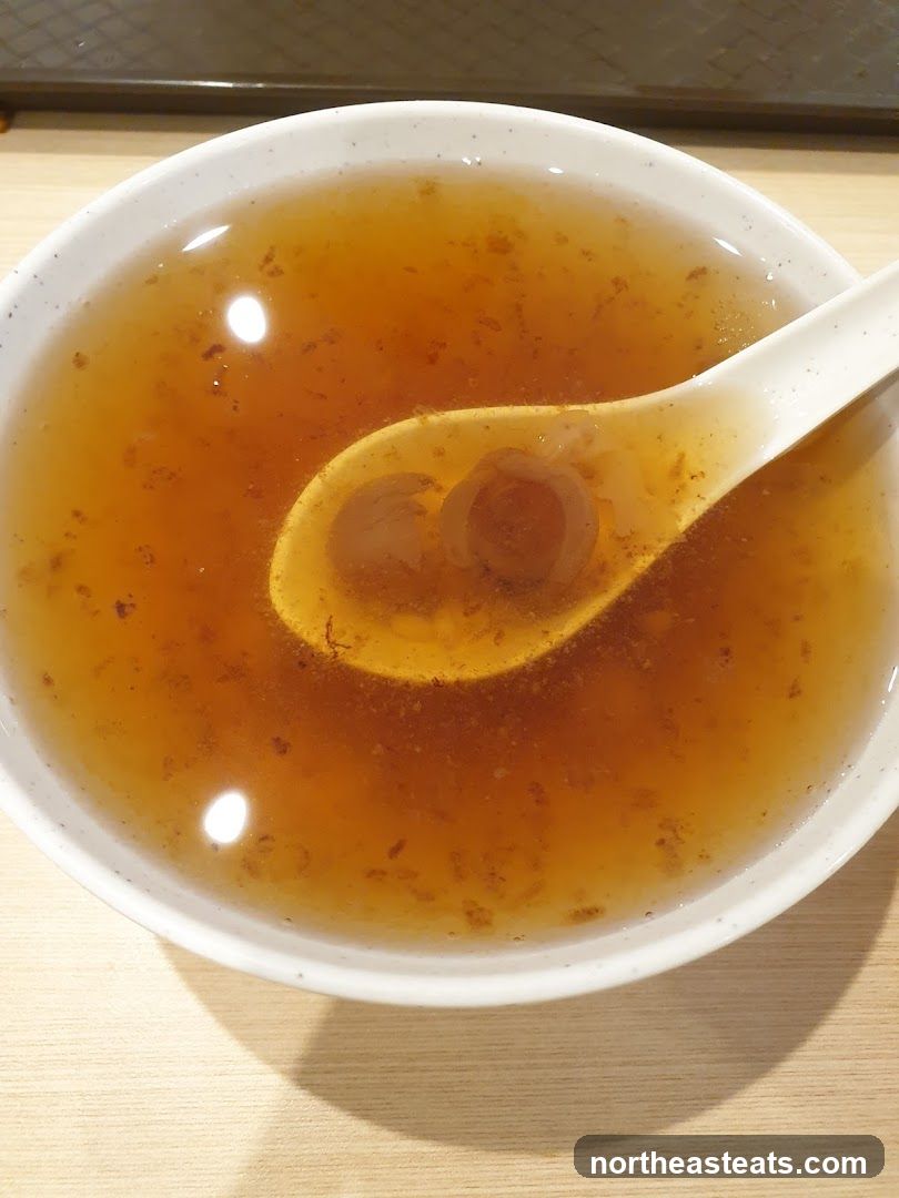 Bowl of Broth with Spoon