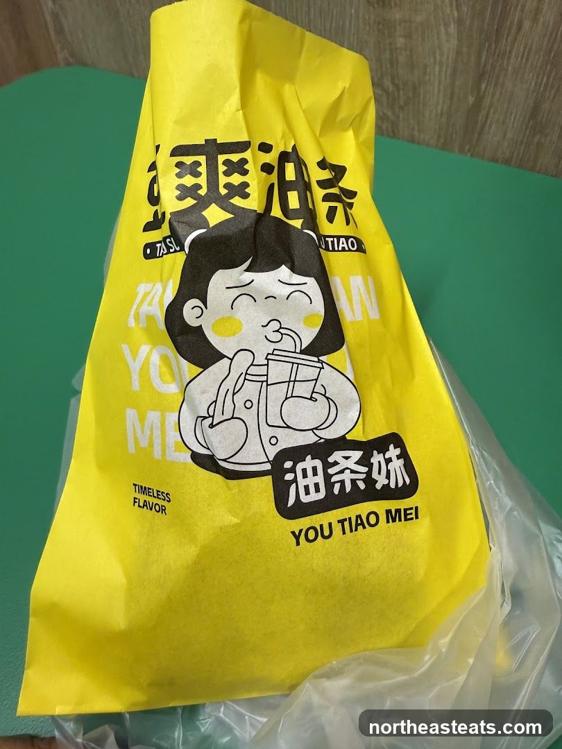 Yellow paper bag with cartoon character and Chinese text