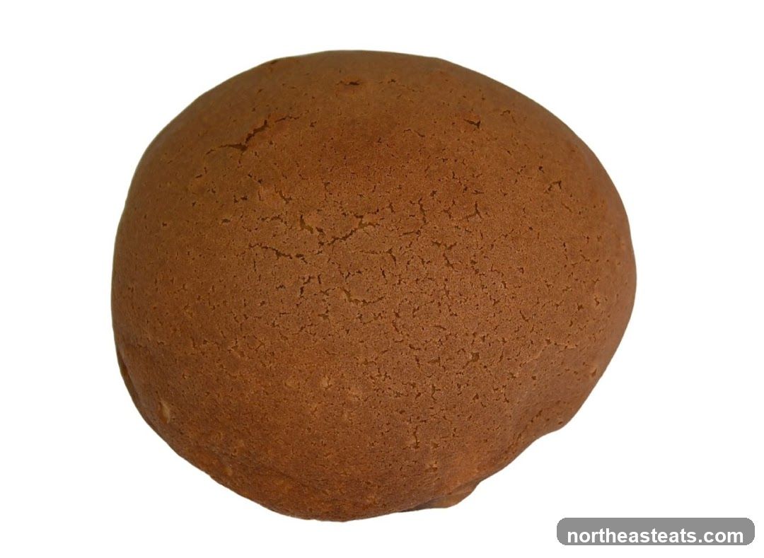A close-up of a round, brown pastry