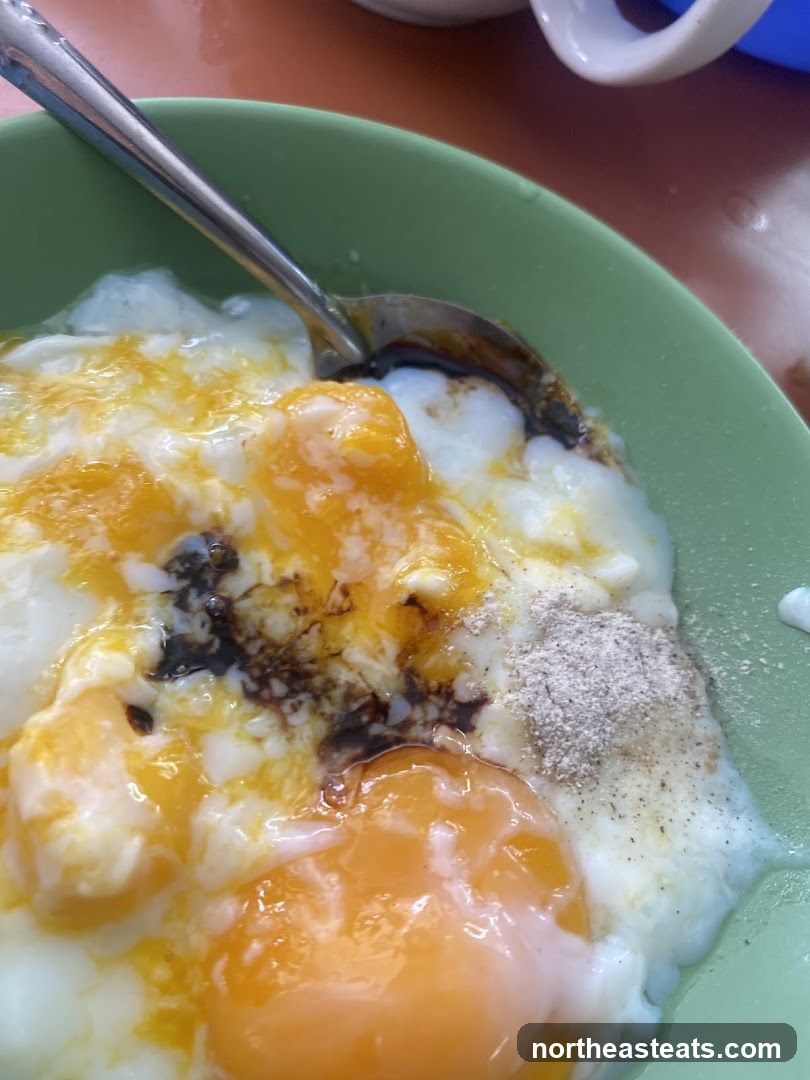 Soft-boiled eggs with soy sauce and pepper