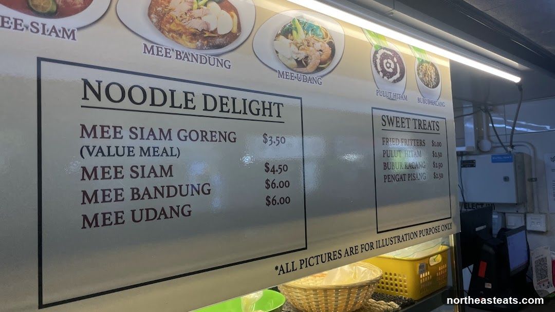 A menu board displaying noodle dishes and sweet treats.
