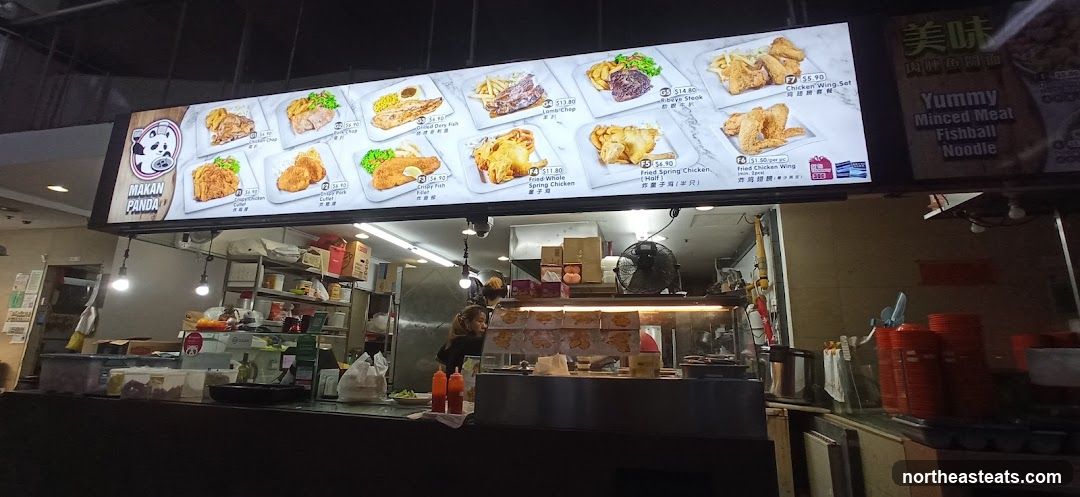 A brightly lit menu board displaying various food items with images and prices.