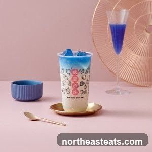 Blue and white layered drink with ice