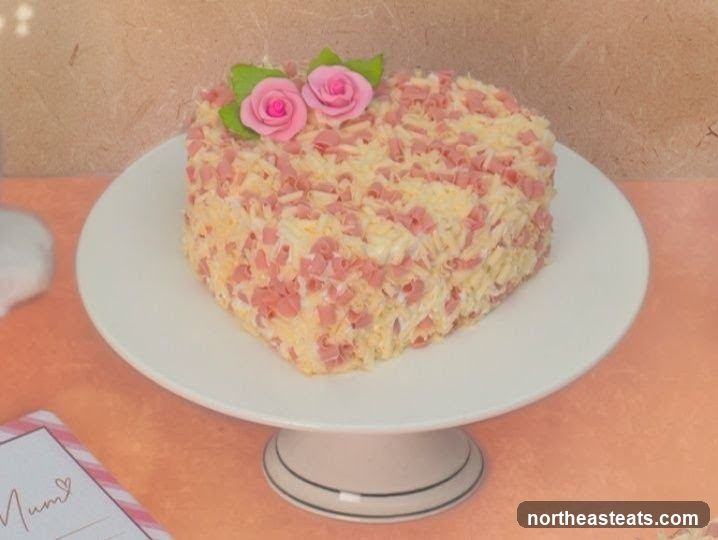 Heart-shaped cake with ham and cheese topping