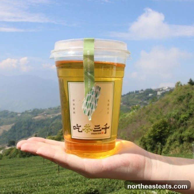 Tea in a cup held by a hand