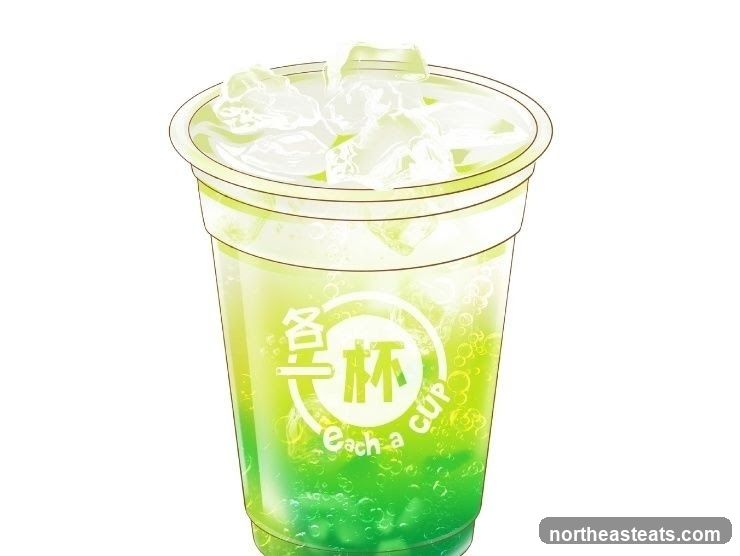 Green beverage with ice and bubbles