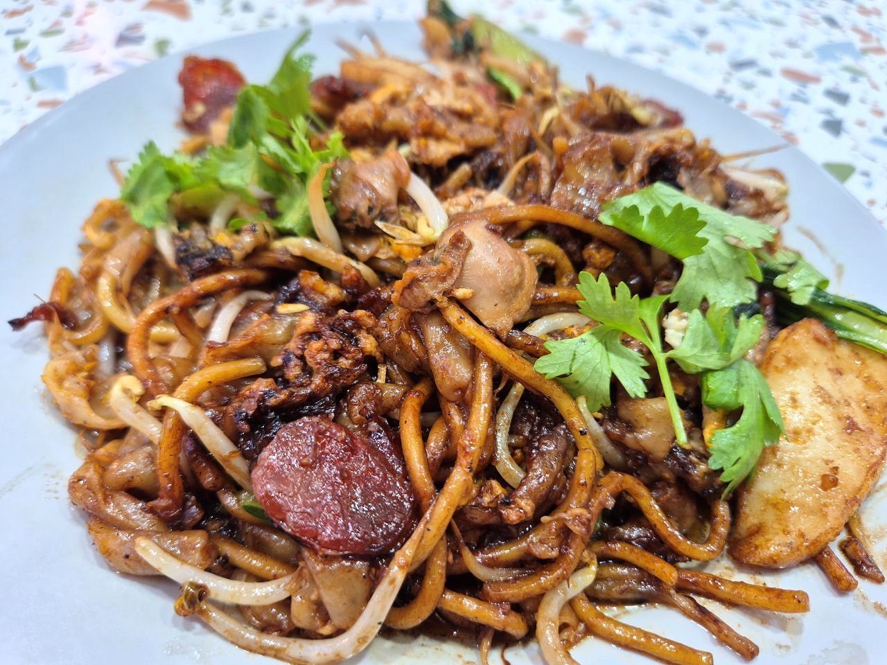 Fried kway teow with lap cheong, fishcake and bean sprouts from the Hougang Avenue 8 stall