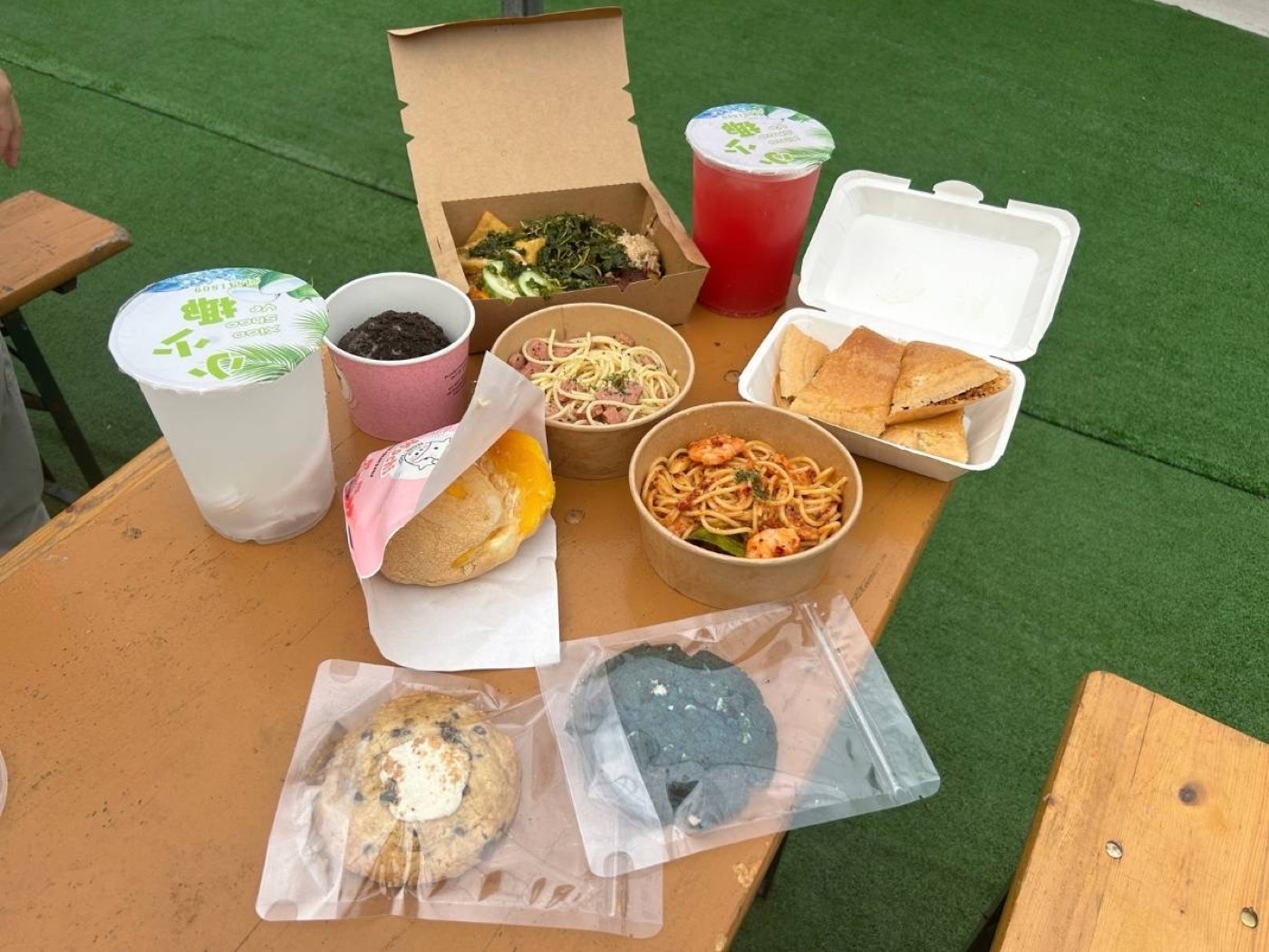 Plates from Punggol pasar malam stalls including pasta, ayam gepuk, and mochi desserts, October 2026