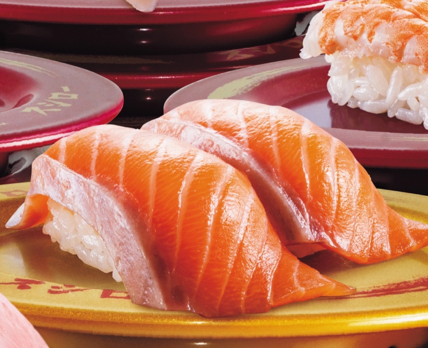 Sushiro salmon nigiri on a gold plate, the style of dish in the Hougang Mall opening promo